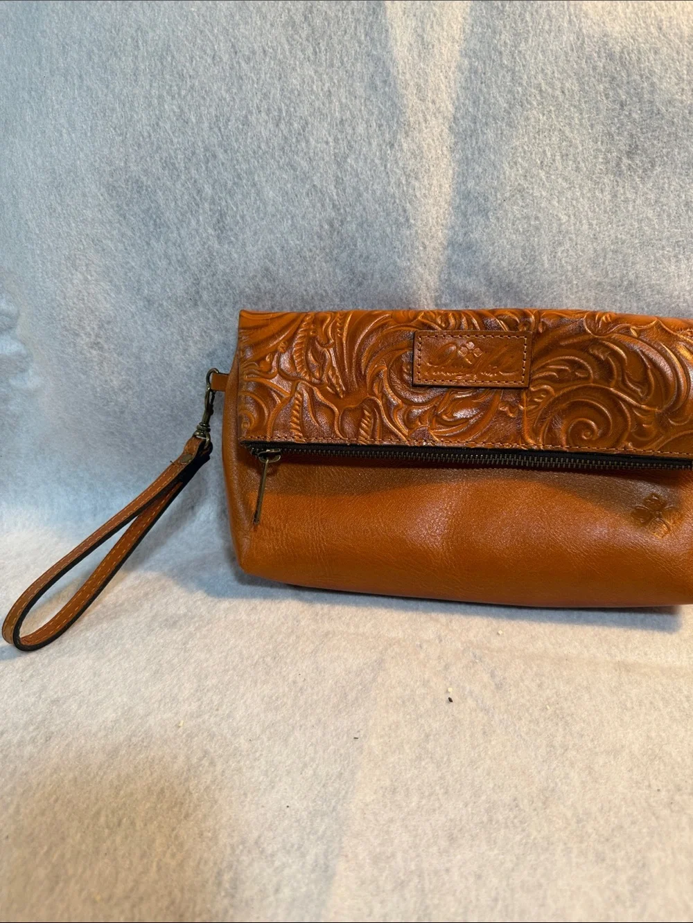 Patricia Nash Tooled Floral Leather Wristlet in Cognac Brown